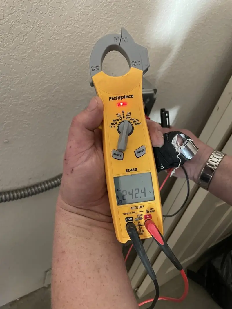Voltage testing with clamp meter during Recessed Lighting Installation in Cornelius